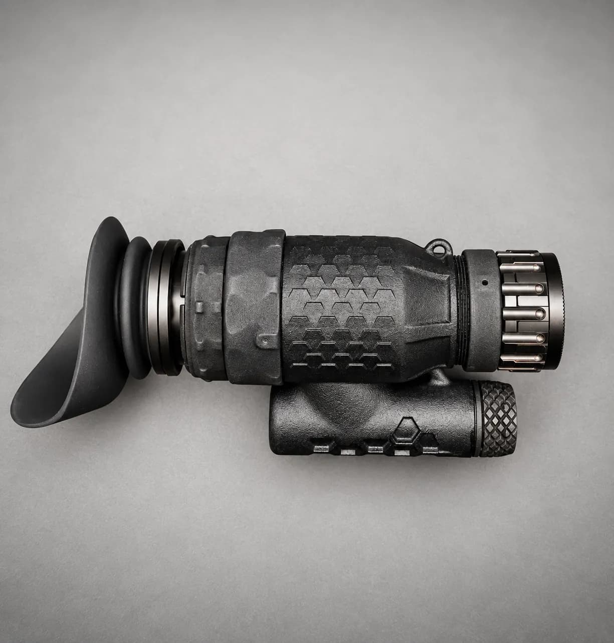 LNVM in profile, hexagonal housing texture and battery compartment, grey studio background